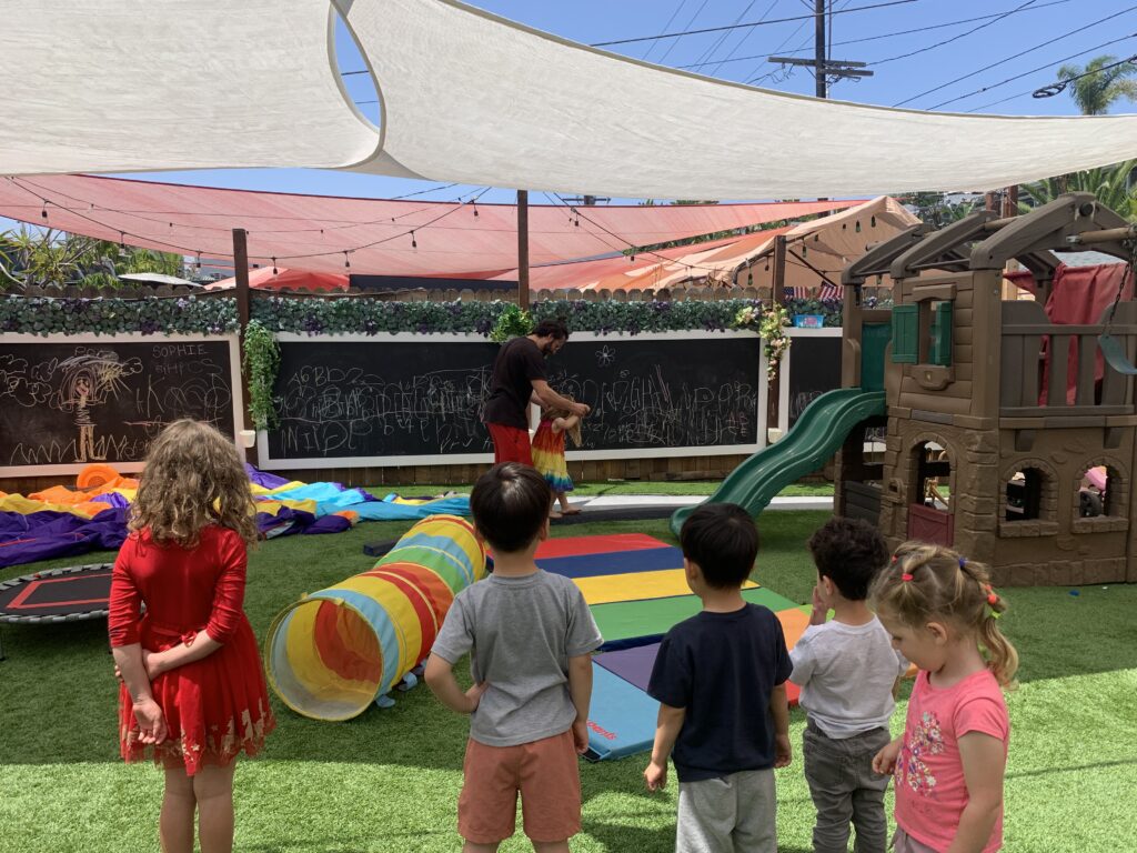 Children playing at an outdoor playground.