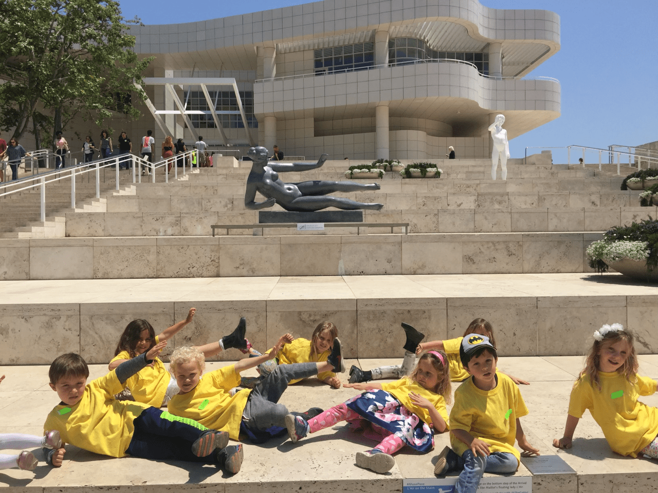 Children posing with sculptures at the Getty.