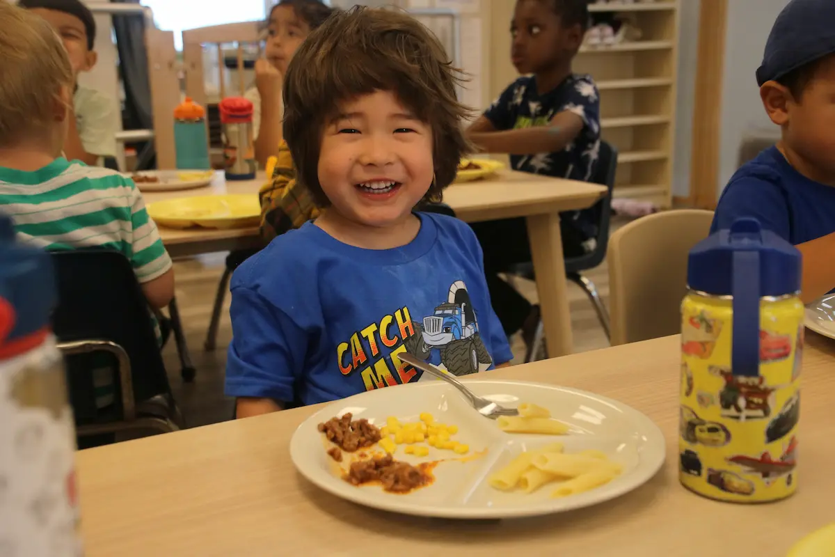 kid eating organic food at Montana preschool